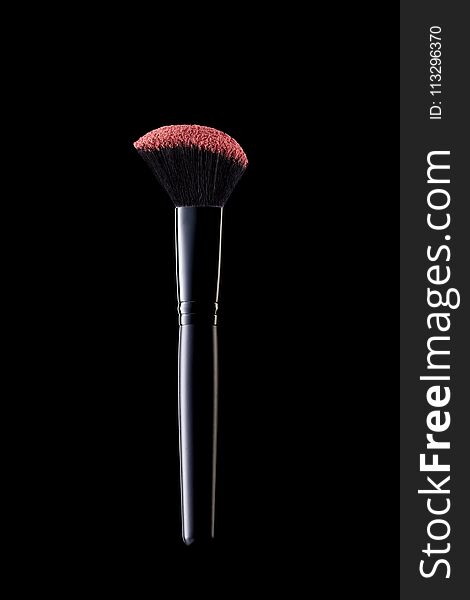 Makeup Brush On Black Background. Close Up Of Professional Cosmetics Soft Blush Brush With Violet Powder. Makeup Tools. High Quality Image.