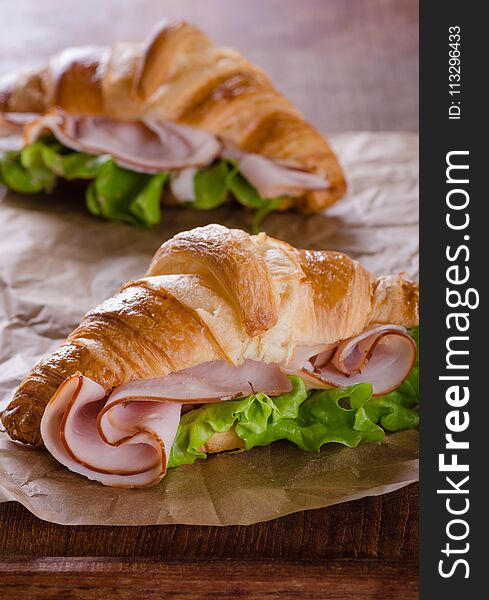 Fresh Croissant With Ham And Salad