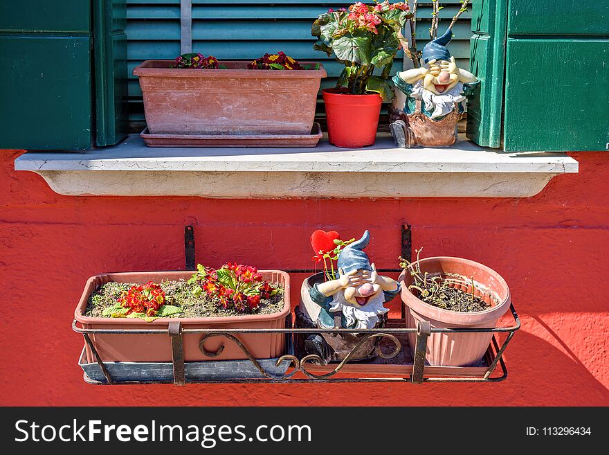 Daylight View To Flowers In Pot On Balcony And Windowsill