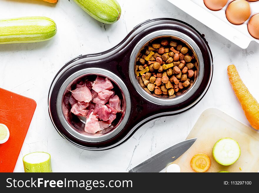 Dogfood Set With Cut Vegetables And Knife On Table Background To