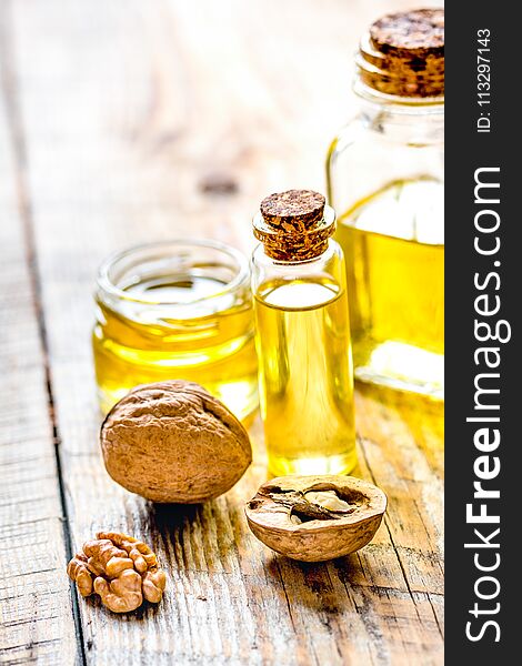 Cosmetic And Therapeutic Walnut Oil On Wooden Background
