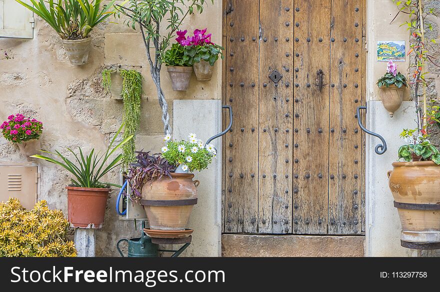 Beautiful street in Valldemossa with traditional flower decoration, famous old mediterranean village of Majorca. Balearic island