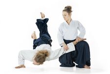 Man And Woman Fighting At Aikido Training In Martial Arts School Royalty Free Stock Image