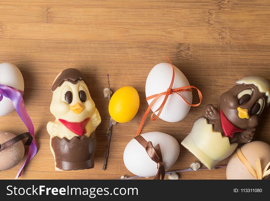 Easter Eggs With Color Ribbon And Chocolate Cute Chicken On The Orange Background