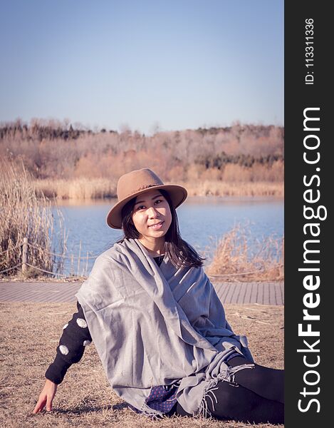 Portrait of a happy young lovely asian girl in the autumn. Portrait of a happy young lovely asian girl in the autumn