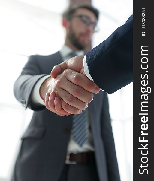 Business Leader Shaking Hands With Partner.