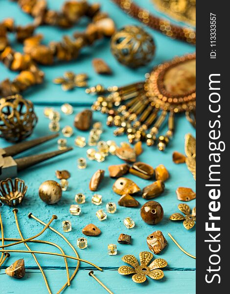 Tools, bead tiger-eye, accessories for making jewelry. Needlework. shallow DOF