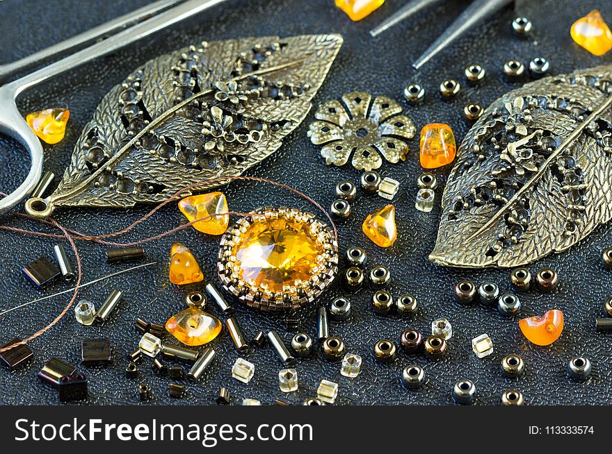 Tools, beads amber, accessories for making jewelry. Needlework. shallow DOF