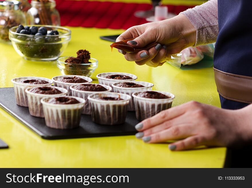 Close Up Of Decorating Cupcakes