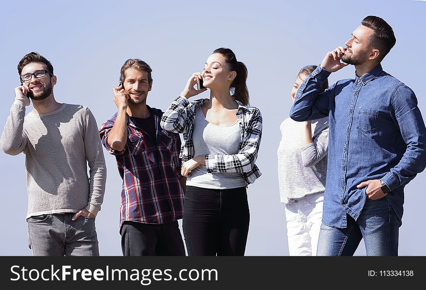 Group of students talking on their smartphones.photo with copy space