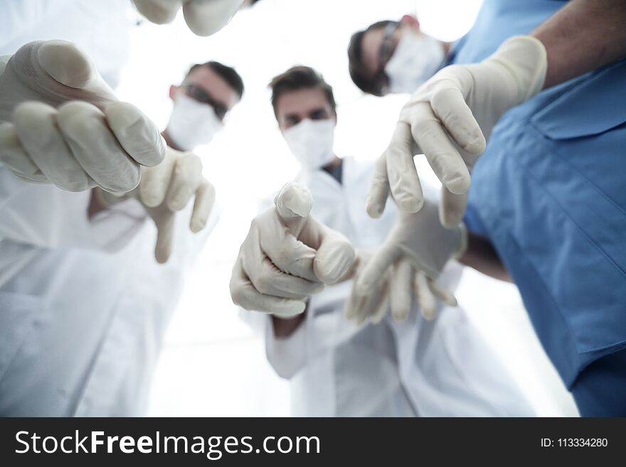 Bottom view.a group of doctors in the operating room.the concept of teamwork