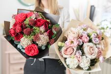Beautiful Luxury Bouquet Of Mixed Flowers In Woman Hand. The Work Of The Florist At A Flower Shop. A Small Family Royalty Free Stock Photos Beautiful Luxury Bouquet Of Mixed Flowers In Woman Hand. The Work Of The Florist At A Flower Shop. A Small Family Royalty Free Stock Photos