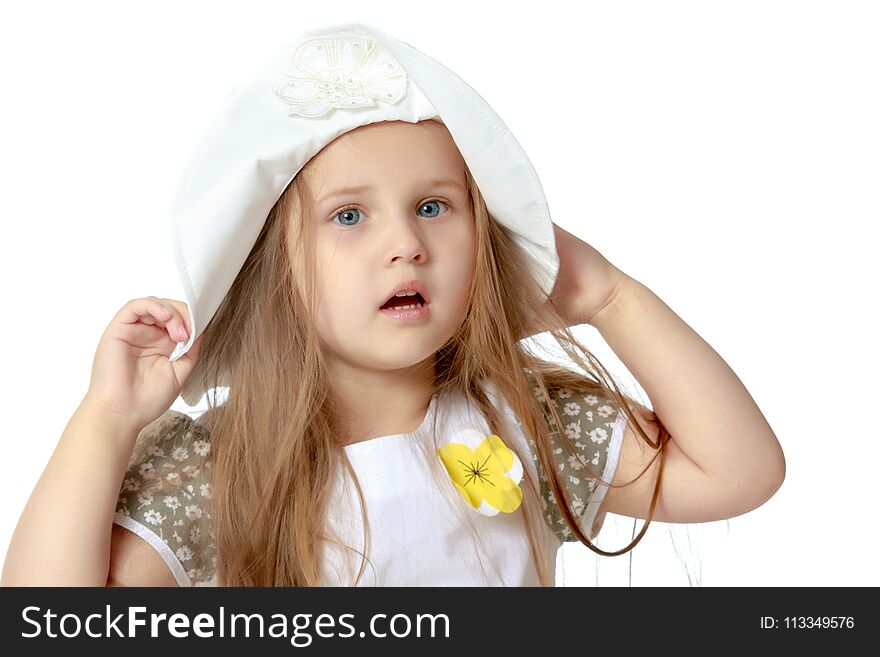 Little girl in a hat. The concept of fashion, children`s recreation at sea. Isolated on white background.