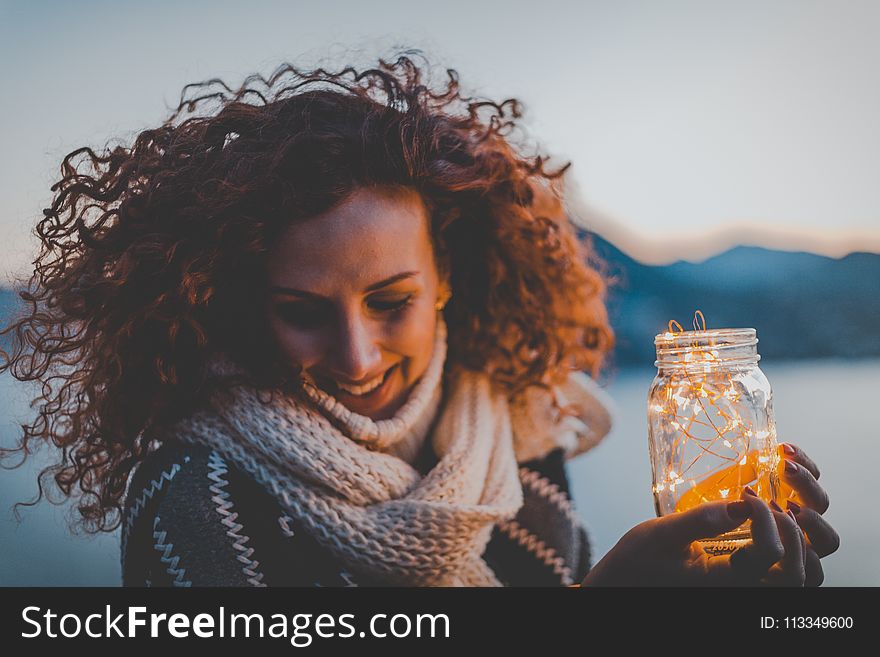 Woman Holding Lighted Jar