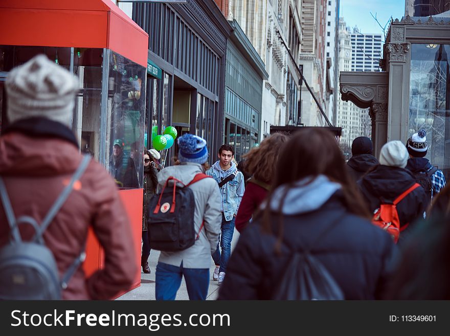 People Walking on Sidewalk