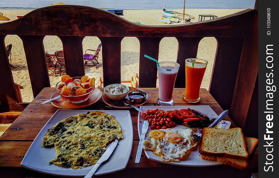 Fried Egg and Egg Omelet on Plate