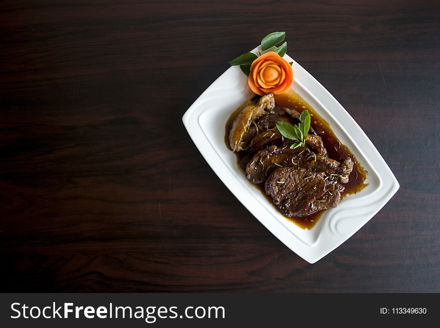 Meat With Sauce Dish on White Ceramic Plate