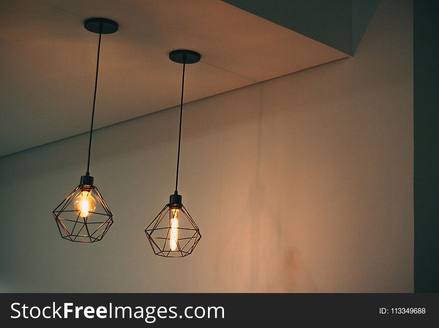 Two Black Pendant Lamp On White Concrete Ceiling