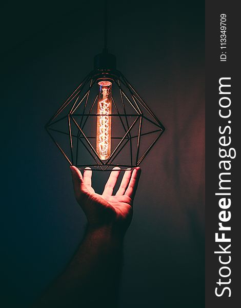 Person Holding Pendant Light