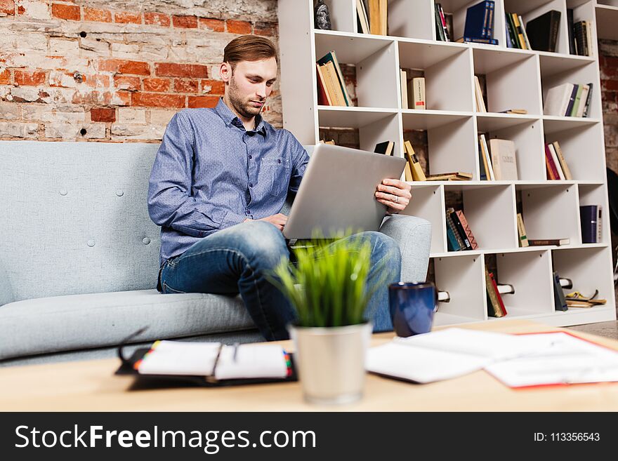 Young man working on laptop. Young man working on laptop