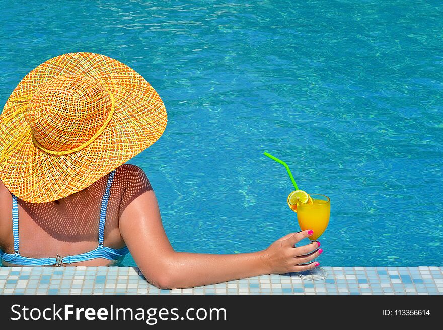 Real female beauty relaxing in swimming pool, summer vacation concept