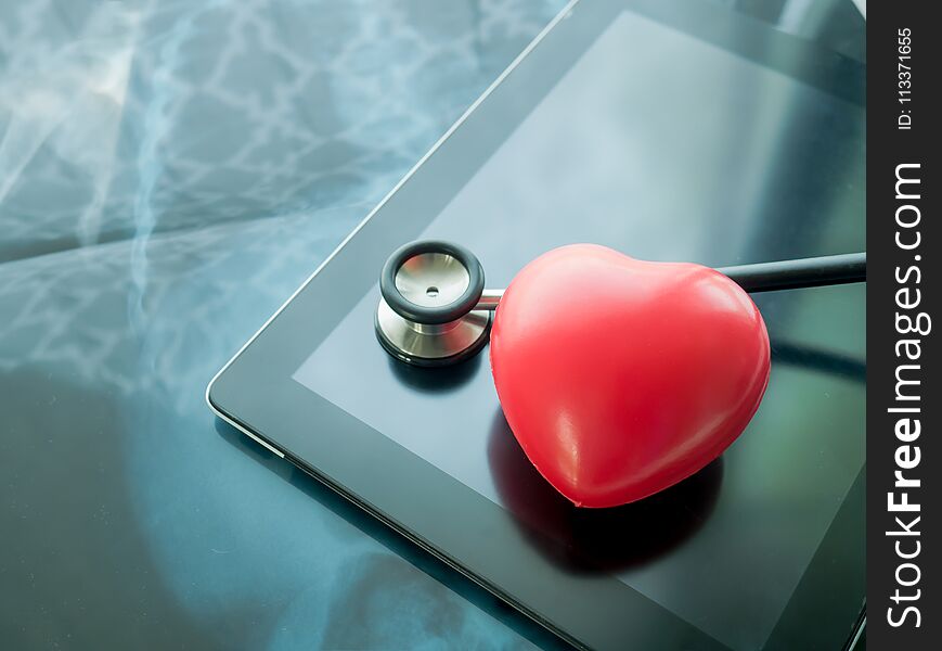 Red Heart And Stethoscope On Laptop. Heart Disease And Health Ca