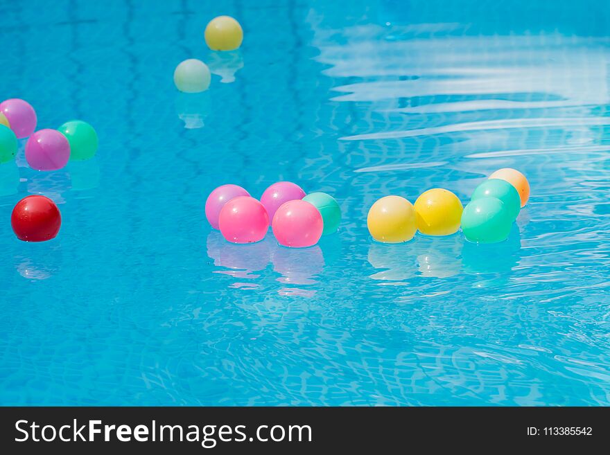 Colorful plastic balls in swimming pool.