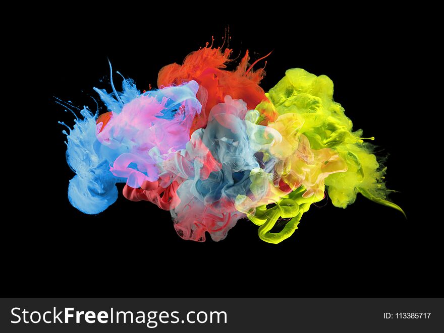 Acrylic colors in water. Ink blot. Abstract background. Isolated on black. Acrylic colors in water. Ink blot. Abstract background. Isolated on black.