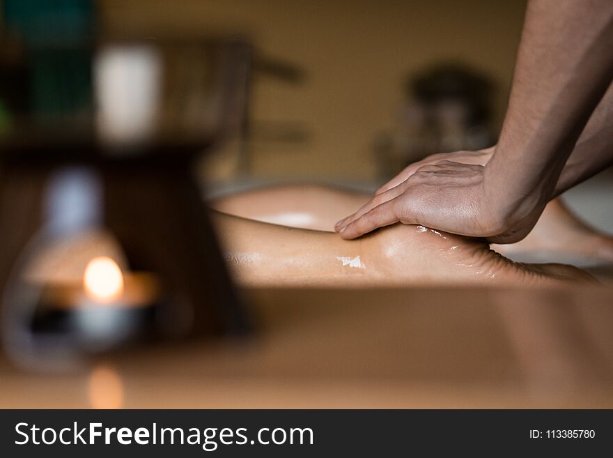 Professional Masseur Doing Deep Tissue Oiled Massage to a Girl at Ayurveda Massage Session