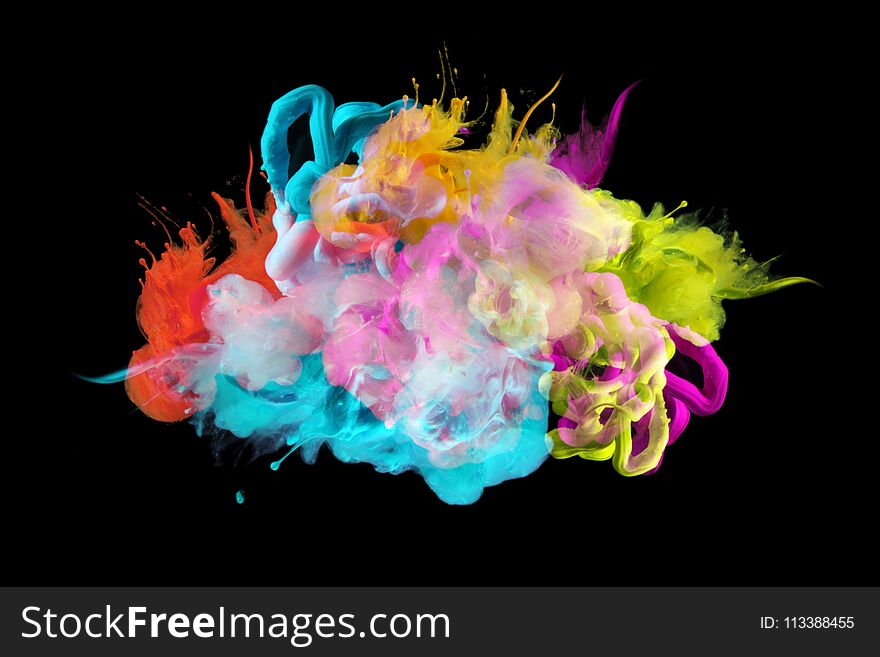 Acrylic colors in water. Ink blot. Abstract background. Isolated on black. Acrylic colors in water. Ink blot. Abstract background. Isolated on black.