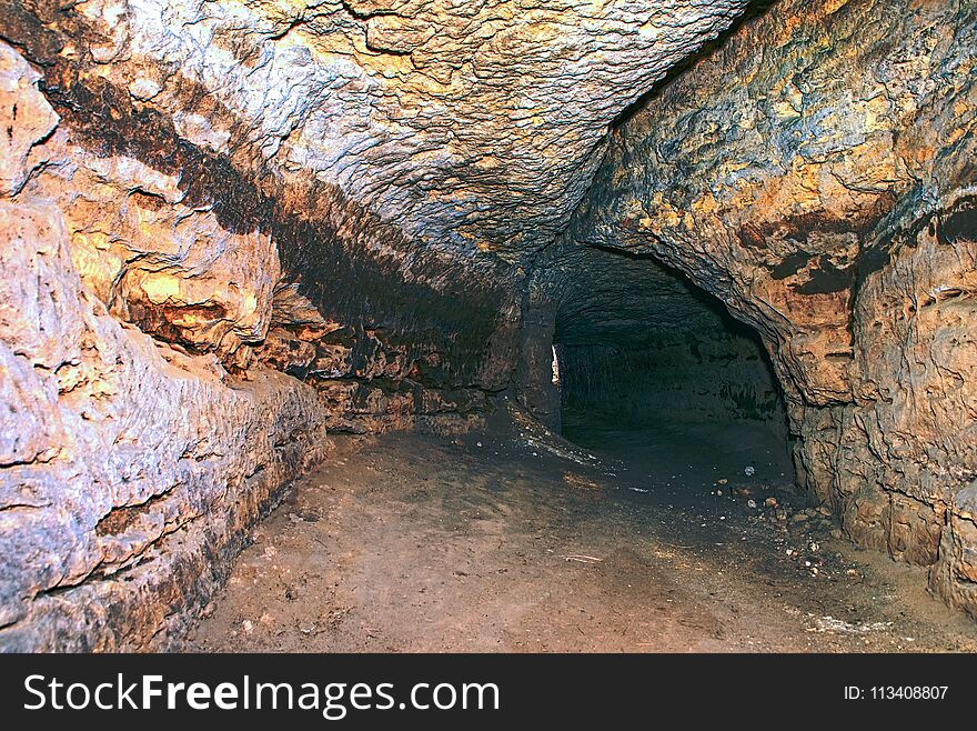Underground City. Abandoned and collapsed sandstone tunnels and dome. Old dark corridor