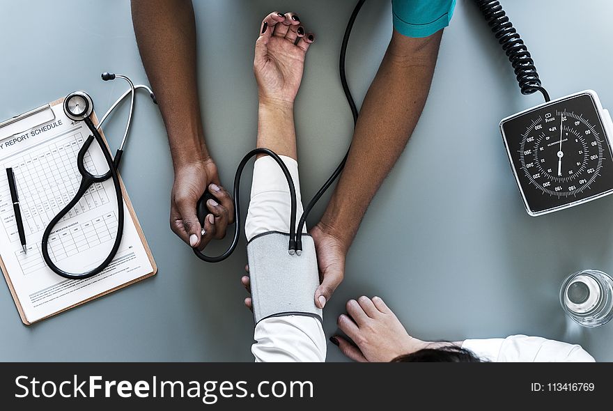 Person Using Black Blood Pressure Monitor