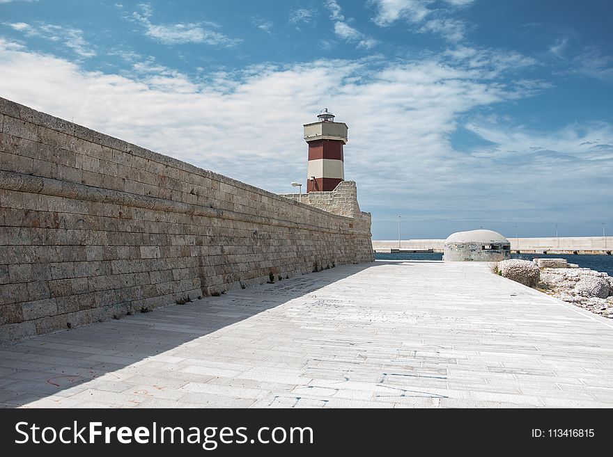 Brown And White Striped Lighthouse