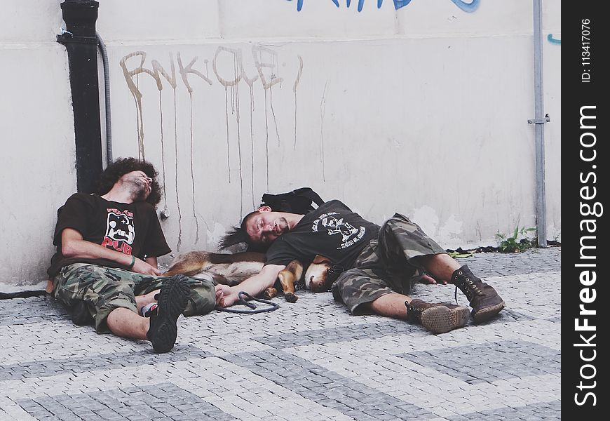 Photo of Men Sleeping on the Street