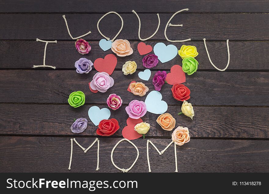 Forming the word: i love MOM on background