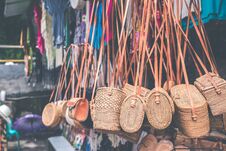 Rattan Handbags Hanging In The Outdoor Local Asian Store. Bali Island. Stock Photo
