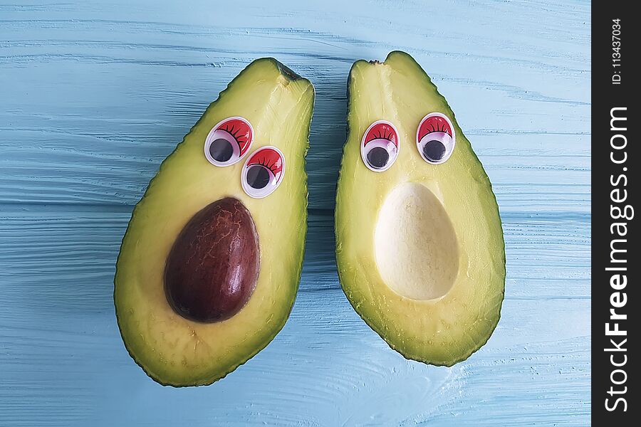 Avocado Cartoon Eyes On Blue Wooden Concept