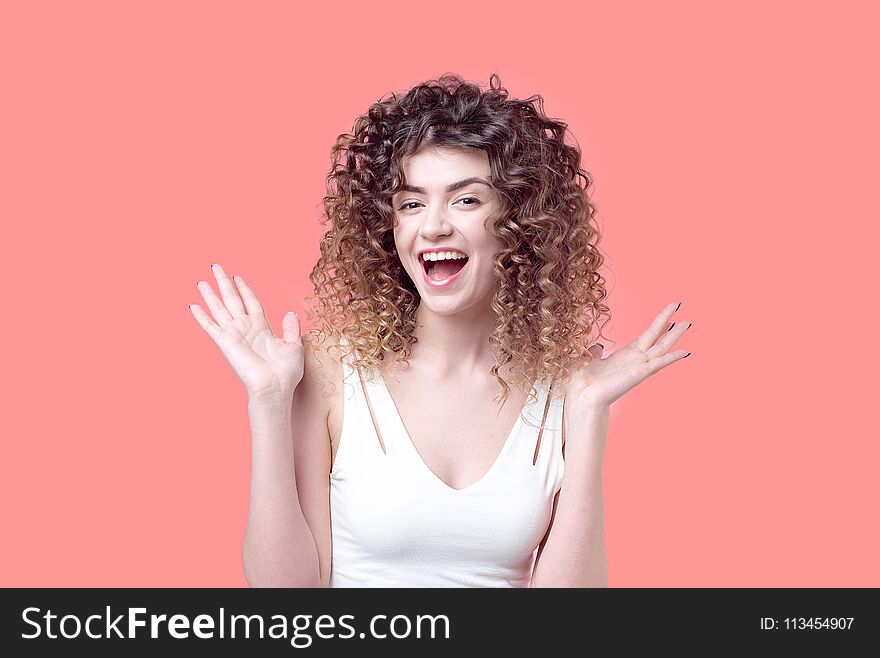 Beautiful Young Girl With Incredible Curls Smiles Surprised