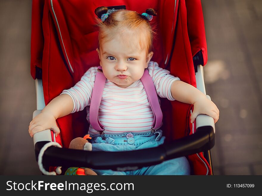 Expressive Girl In Carriage