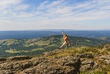 Girl Jumping High In The Mountains Stock Photos