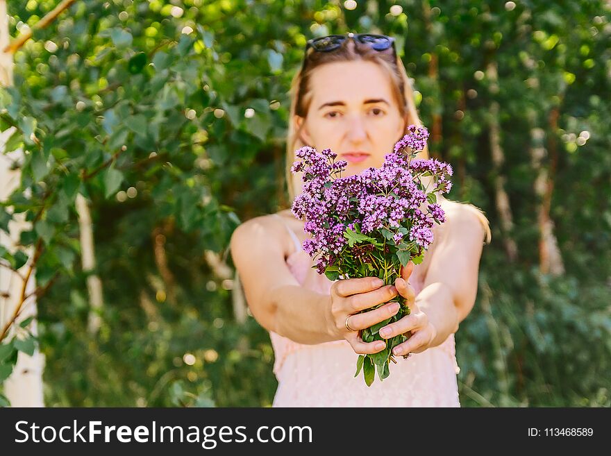 Girl with a bouquet of flowers