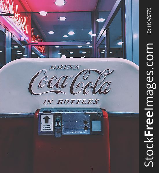 Red and White Drink Coca-cola in Bottle Dispenser