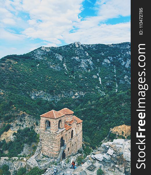 High Angle Photography Of Brown Structure Surrounded By Mountains