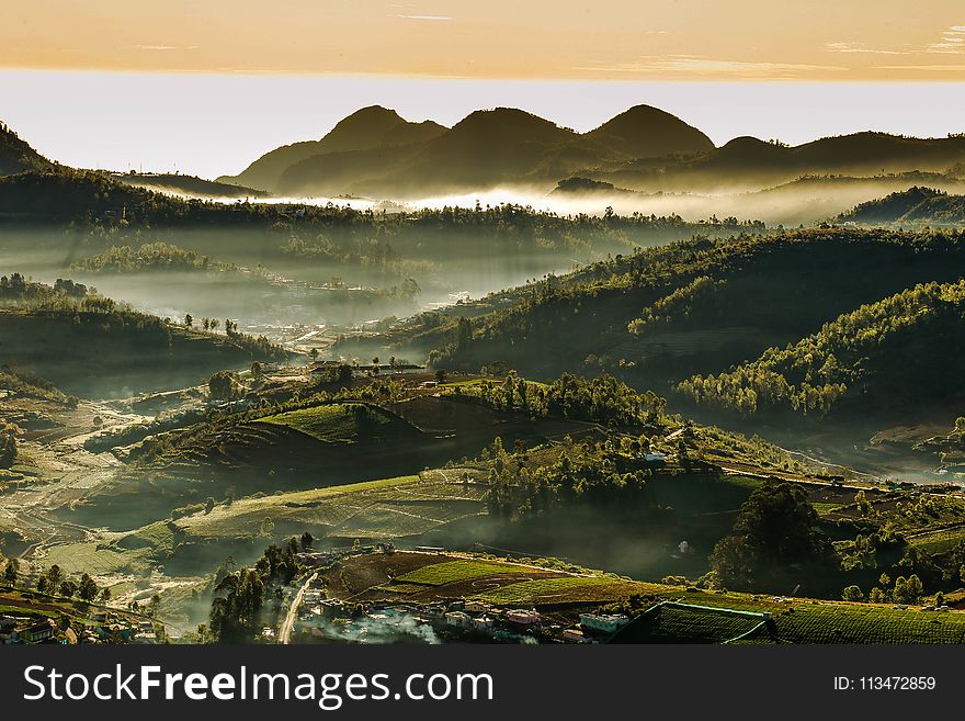 Green Mountain Under White Sky