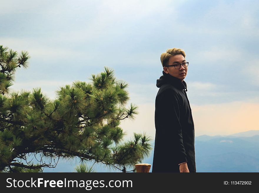 Photo Of Man Wearing Black Coat