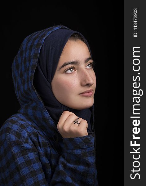 Woman in Black and Blue Plaid Headscarf