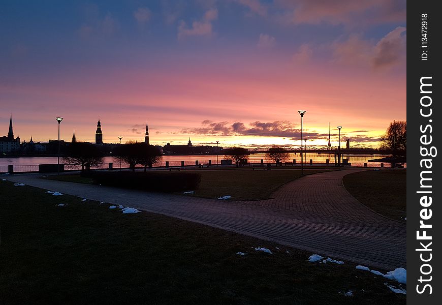 Cloudy Blue and Orange Sky over Park