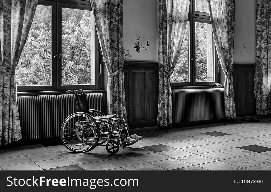 Grayscale Photo of Wheelchair