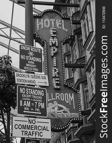 Grayscale Photo of Hotel Empire Signage