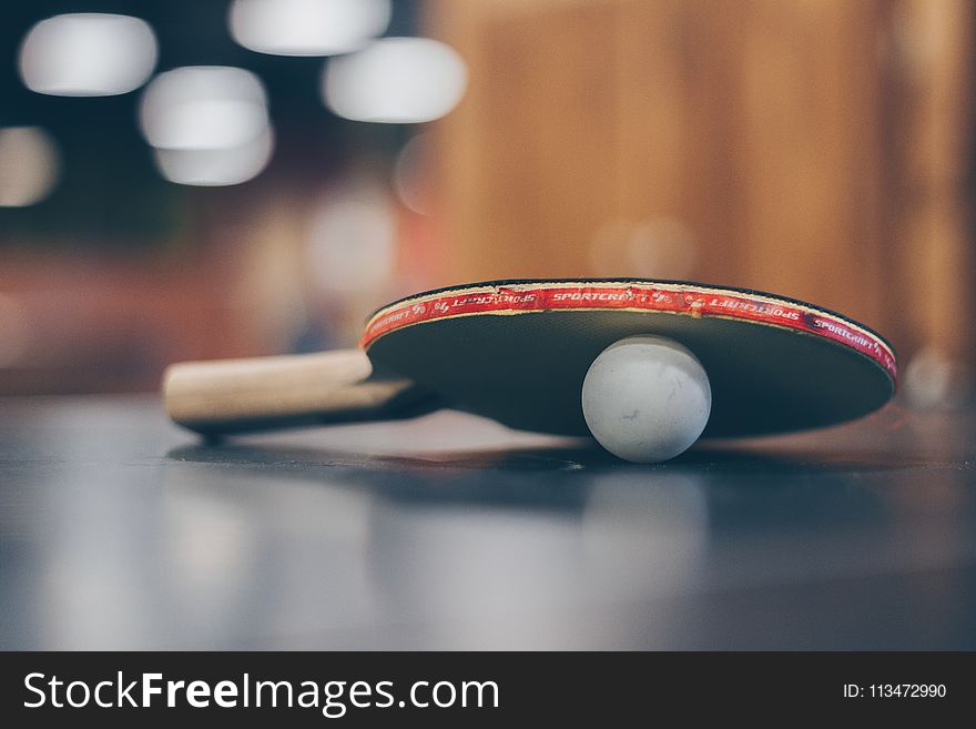 Selective Focus Photo of Table Tennis Ball and Ping-pong Racket